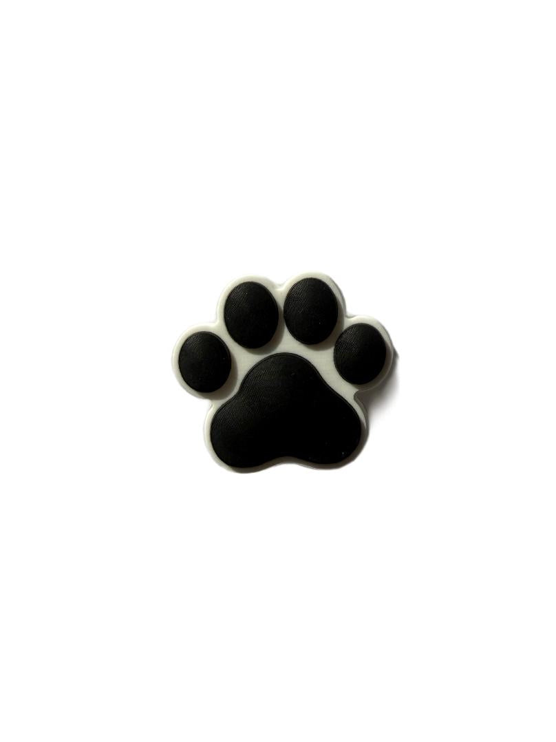 Black paw pin in silicone material. 